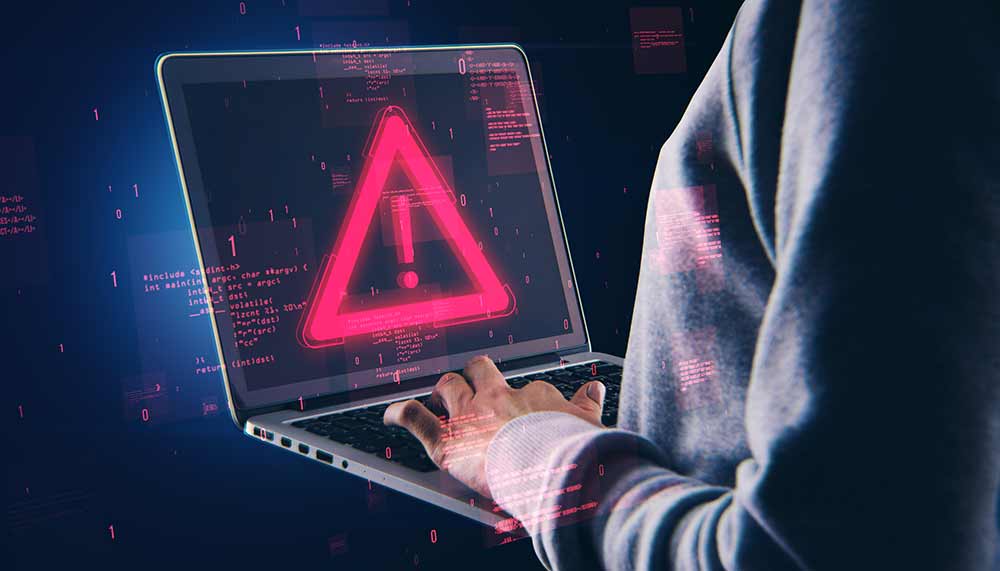 Laptop mit digitalem Warnsymbol für Cyberangriff und Zero-Day-Exploit